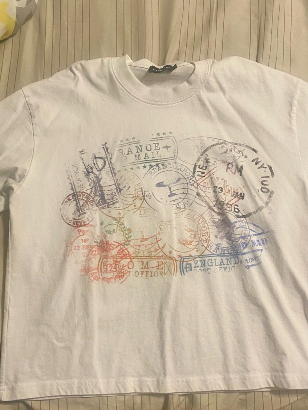 White Long-Sleeve Graphic Crewneck Shirt with Travel Stamp Design